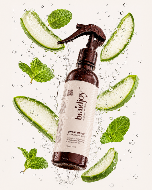 Amber braidjoy Sweat Reset cooling scalp spray surrounded by splashing water, aloe slices, and mint leaves, highlighting a refreshing scalp spray that cools, soothes itch, clears sweat buildup, and hydrates between wash days.