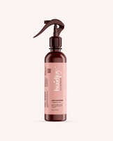 Amber braidjoy Ease on Down takedown tonic with a pink label on a light background, designed to soften braids and shed hair, condition natural hair, reduce breakage, and make braid removal easier for kids, tender heads, and thick hair.