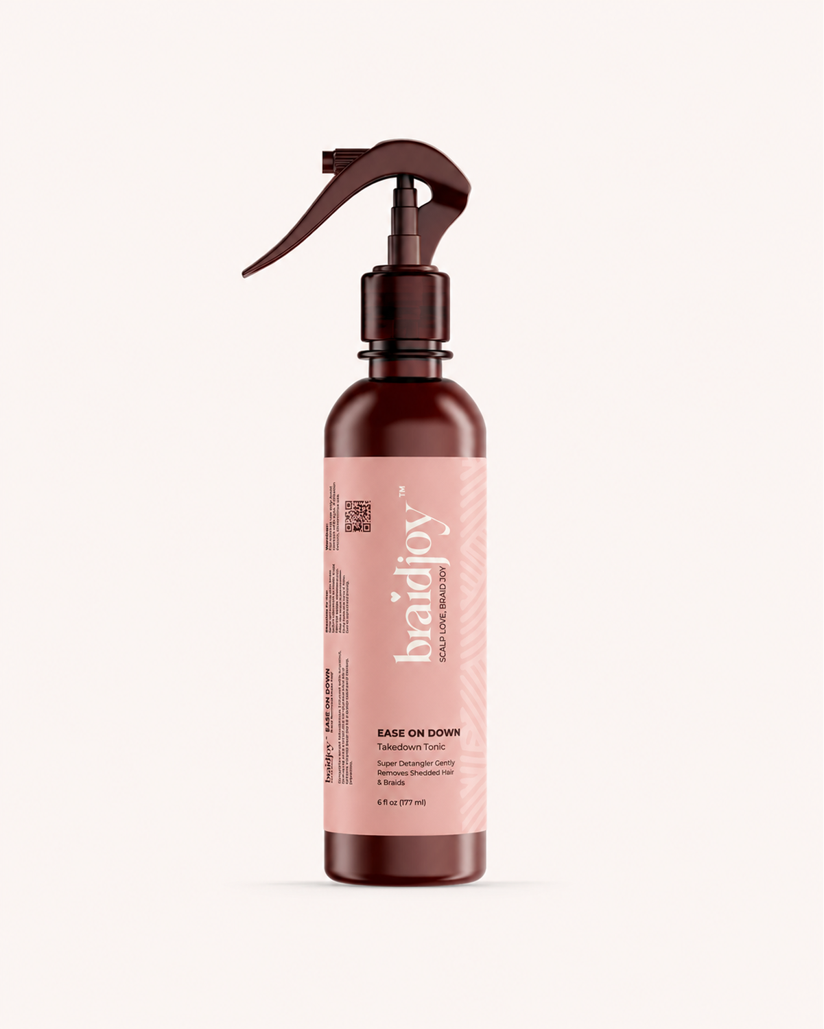 Amber braidjoy Ease on Down takedown tonic with a pink label on a light background, designed to soften braids and shed hair, condition natural hair, reduce breakage, and make braid removal easier for kids, tender heads, and thick hair.