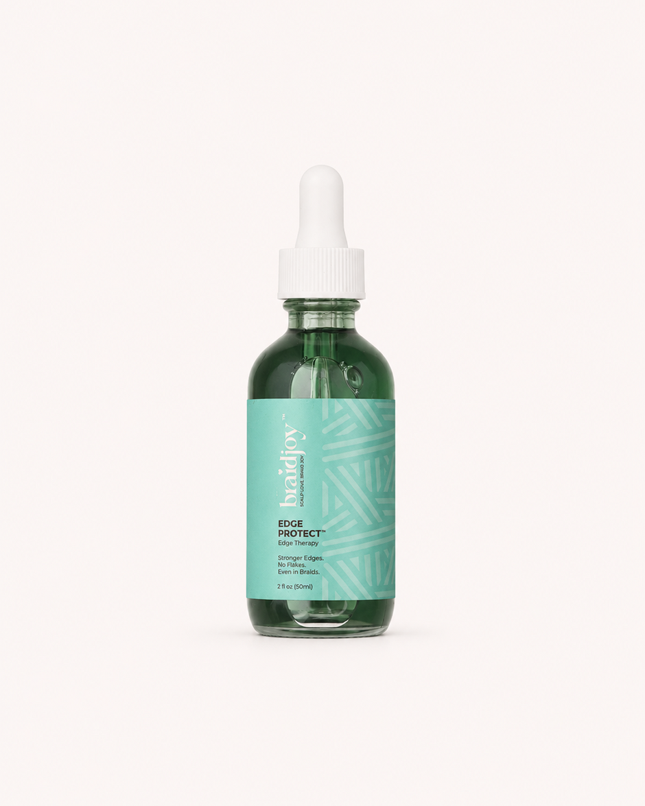 Green glass braidjoy Edge Protect edge therapy serum with a teal label and white dropper, designed to protect fragile edges, soothe irritation, reduce breakage from tight styles, and support stronger, healthier hair growth without buildup.